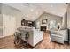Bright living room featuring a vaulted ceiling, wood floors, and a cozy fireplace at 6072 Pierson Ct, Arvada, CO 80004