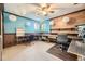 Home office featuring two desks, built-in shelves, and bright blue walls at 6072 Pierson Ct, Arvada, CO 80004