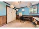 Bright office with built in desk, storage, and unique lighting fixture at 6072 Pierson Ct, Arvada, CO 80004