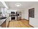 This kitchen features stainless steel appliances, white cabinets, and lots of natural light at 3298 S Krameria St, Denver, CO 80222