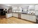 Kitchen with white cabinets, stainless steel appliances, granite countertops, and lots of natural light at 3298 S Krameria St, Denver, CO 80222