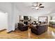 Living room features a fireplace, hardwood floors, lots of natural light, and access to the kitchen at 3298 S Krameria St, Denver, CO 80222