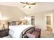 Serene bedroom with plush bedding, bedside tables, and a cozy atmosphere, ideal for restful nights at 15723 E Orchard Pl, Aurora, CO 80016