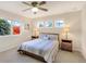 Bright bedroom features large windows, side tables, lamps and decorative bedding, creating an airy retreat at 15723 E Orchard Pl, Aurora, CO 80016
