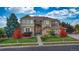 Beautiful two-story home with a well-maintained lawn, mature trees, and inviting front entrance at 15723 E Orchard Pl, Aurora, CO 80016
