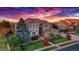 View of the front elevation of the home with its beautiful landscaping at 15723 E Orchard Pl, Aurora, CO 80016