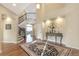 Elegant foyer with decorative staircase and hardwood flooring at 15723 E Orchard Pl, Aurora, CO 80016