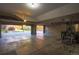 Spacious garage featuring an open garage door showing the front yard and beautiful autumn foliage at 15723 E Orchard Pl, Aurora, CO 80016