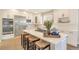 Bright modern kitchen with stainless steel appliances, center island, and lots of cabinet space at 15723 E Orchard Pl, Aurora, CO 80016