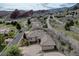 High angle view of luxury home in front of a mountain landscape and neighborhood roads at 5951 Rain Dance Trl, Littleton, CO 80125