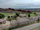 Scenic aerial view of luxury homes nestled near a golf course and mountains at 5951 Rain Dance Trl, Littleton, CO 80125