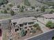 Beautiful exterior of the home featuring stone accents, landscaped yard, and a private balcony with scenic views at 5951 Rain Dance Trl, Littleton, CO 80125