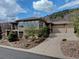 Stunning home with a three-car garage, landscaped front yard, and stone and stucco accents at 5951 Rain Dance Trl, Littleton, CO 80125