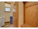Functional laundry room with new appliances and ample storage space, featuring hooks, bench, and natural light at 5951 Rain Dance Trl, Littleton, CO 80125