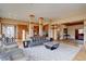 Open concept living room with hardwood floors, natural light and stylish furniture at 5951 Rain Dance Trl, Littleton, CO 80125