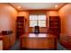 Dedicated office space featuring custom built-ins, a large window, and privacy at 5951 Rain Dance Trl, Littleton, CO 80125