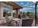 Exterior patio view with a pergola, table, chairs and scenic views at 5951 Rain Dance Trl, Littleton, CO 80125