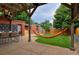 Relax in this backyard featuring a hammock, outdoor dining, and grassy lawn at 3237 N Josephine St, Denver, CO 80205