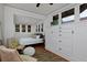 Bright bedroom featuring windows, built in storage, and two chairs at 3237 N Josephine St, Denver, CO 80205