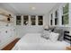 Bright bedroom features windows, built in storage, and hardwood floors at 3237 N Josephine St, Denver, CO 80205