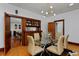 Bright dining room featuring a glass table, decorative chandelier, and built-in hutch at 3237 N Josephine St, Denver, CO 80205