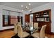 Bright dining room with a glass table, modern lighting, and hardwood floors at 3237 N Josephine St, Denver, CO 80205