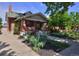 Beautiful brick home with lush greenery and a well-maintained yard at 3237 N Josephine St, Denver, CO 80205