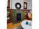 Close-up of a stylish tiled fireplace with built-in shelving and hardwood floors at 3237 N Josephine St, Denver, CO 80205