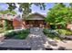 Charming brick home with well-manicured landscaping and a welcoming front porch, perfect for curb appeal at 3237 N Josephine St, Denver, CO 80205