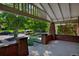 Spacious covered front porch with classic brick columns and manicured landscaping at 3237 N Josephine St, Denver, CO 80205