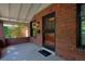 Inviting front porch with brick accents and an elegant security door at 3237 N Josephine St, Denver, CO 80205
