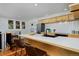 Modern kitchen features a breakfast bar, stainless steel appliances, and modern cabinets at 3237 N Josephine St, Denver, CO 80205