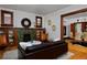 Elegant living room with a tiled fireplace, built-in shelving, and hardwood floors at 3237 N Josephine St, Denver, CO 80205