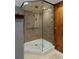This luxurious tiled shower features glass doors, dual shower heads, and built-in shelving at 3237 N Josephine St, Denver, CO 80205