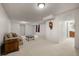 Spacious finished basement with plush carpeting, stylish coffee table, and comfortable sofa at 7761 S Curtice Dr # C, Littleton, CO 80120