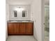 Bathroom features double sinks with granite countertops, modern lighting, and a glass enclosed shower at 7761 S Curtice Dr # C, Littleton, CO 80120