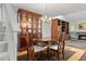 Dining room with a chandelier, hardwood floors, and elegant furniture, adjacent to the living area at 7761 S Curtice Dr # C, Littleton, CO 80120