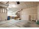 Spacious garage with storage cabinets and access door to home at 7761 S Curtice Dr # C, Littleton, CO 80120