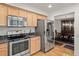 Bright kitchen with stainless steel appliances and granite countertops, perfect for cooking and entertaining at 7761 S Curtice Dr # C, Littleton, CO 80120