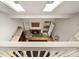 Skylights illuminate the living room, complemented by a cozy fireplace, and an inviting open door at 7761 S Curtice Dr # C, Littleton, CO 80120