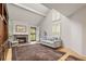 Bright living room with hardwood floors, fireplace, vaulted ceilings, and ample natural light at 7761 S Curtice Dr # C, Littleton, CO 80120