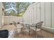 Private patio with table and chairs provides a great space for outdoor relaxation and entertainment at 7761 S Curtice Dr # C, Littleton, CO 80120