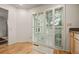 Bright sunroom with shuttered windows, offering a cozy and inviting space to relax and enjoy the natural light at 7761 S Curtice Dr # C, Littleton, CO 80120