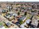 An aerial shot showcasing a residential neighborhood with beautiful homes and mature trees at 2365 S Clayton St, Denver, CO 80210