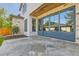 Stylish outdoor patio featuring stone flooring and expansive glass doors at 2365 S Clayton St, Denver, CO 80210