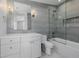 Well-lit bathroom featuring a shower-over-bath, a single vanity and grey tiling at 2365 S Clayton St, Denver, CO 80210