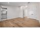 Light-filled bedroom with wood floors and an attached bathroom at 2365 S Clayton St, Denver, CO 80210