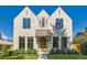 Stunning stone home featuring a copper awning and beautifully framed windows at 2365 S Clayton St, Denver, CO 80210