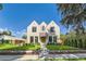 Beautiful two-story stone home with manicured lawn and landscaping at 2365 S Clayton St, Denver, CO 80210
