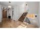 Stunning foyer with hardwood floors, staircase, and abundant natural light at 2365 S Clayton St, Denver, CO 80210